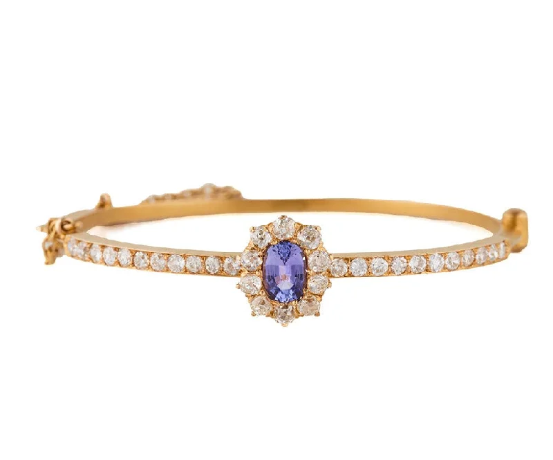 Crystal-Studded Bangles-0.85ct Oval Tanzanite and 2.25ctw Diamond Frame Bangle Bracelet in 14K